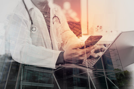 Double exposure of Medical technology concept. Doctor working with smart phone and stethoscope and...
