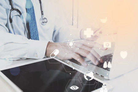 Medical technology concept. Doctor working with smart phone and stethoscope and digital tablet...
