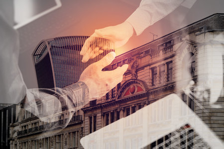 Double exposure of Medical and healthcare concept,Doctor and patient shaking hands in modern office at hospital,London cityの写真素材