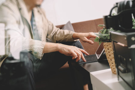 hipster hand using smart phone,digital tablet docking keyboard,coffee cup, payments online...