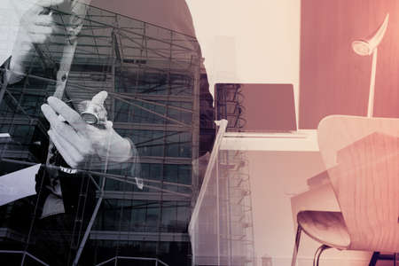 smart medical doctor working with smart phone and digital tablet and laptop computer and stethoscope in modern office at hospital with London city exposureの写真素材