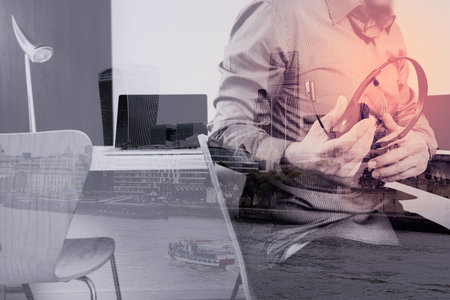 Man using VOIP headset with digital tablet and laptop computer as concept communication,it...