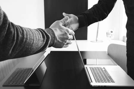 Business partnership meeting concept.photo businessmans handshake. Successful businessmen handshaking after perfect deal,black and whiteの写真素材