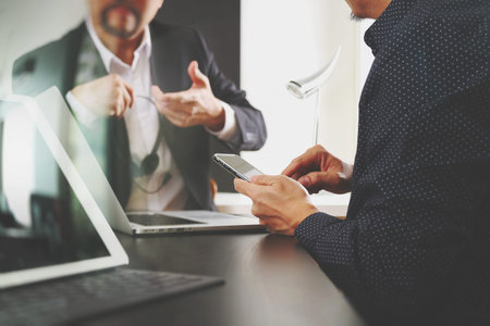 co working team meeting concept,businessman using smart phone and digital tablet and laptop computer...