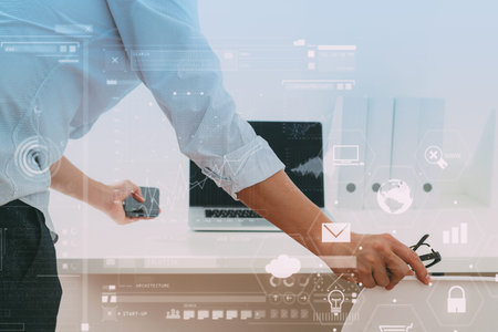 Big data analytics with business intelligence (BI) concept.Businessman working in modern office with...