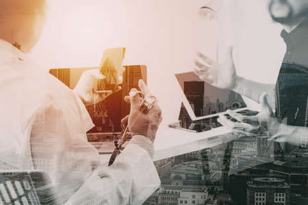 Medical doctor in white uniform gown coat consulting businessman patient having exam as Hospital professionalism concept with city exposureの写真素材