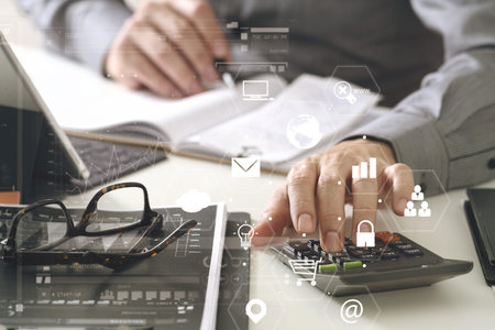 businessman hand working with finances about cost and calculator and latop with mobile phone on...