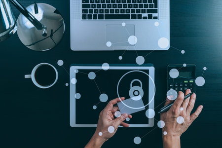 cyber security concept.Top view of hands working with calculator and laptop and credit card and...
