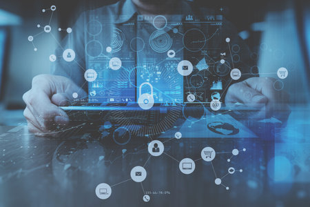 cyber security internet and networking concept.Businessman hand working with VR screen padlock icon on computer backgroundの写真素材