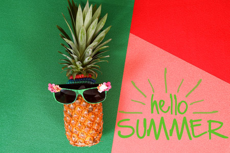 Summer and Holiday concept.Hipster Pineapple Fashion Accessories and Fruits on colorful and hello...