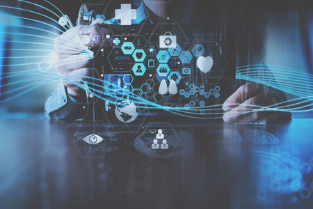 medical techonlogy concept,smart doctor hand working with modern laptop computer in modern office...