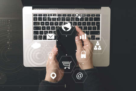 cyber security internet and networking concept.Businessman hand working with VR screen padlock icon mobile phone on laptop computer background cyber security internet and networking concept.Businessman hand working with VR screen padlock icon mobile phone on laptop computer background