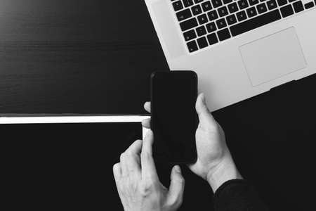 Cyber security internet and networking concept.Businessman hand working with VR screen padlock icon on mobile phone and digital tablet laptop computerの写真素材