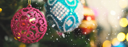 Greeting Season concept.wide shot of ornaments on a Christmas tree with decorative lightの写真素材