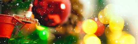 Greeting Season concept.wide shot of ornaments on a Christmas tree with decorative light
