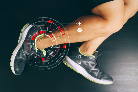 Runner sportsman holding ankle in pain with Broken twisted joint running sport injury and Athletic...