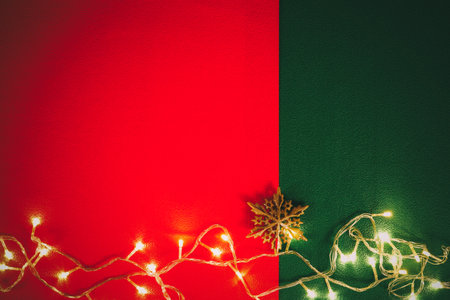 Greeting Season concept.Christmas light and pine star on red and green background