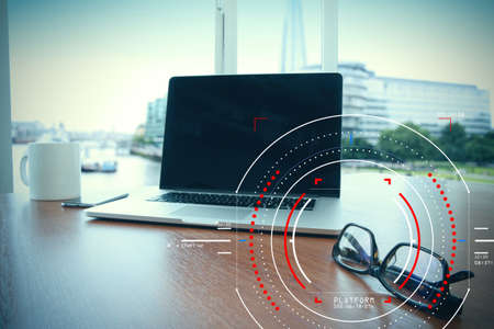 Concept of focus on target with digital diagram,graph interfaces,virtual UI screen,connections netwoork.Workspace of excusive office in modern buildingの写真素材