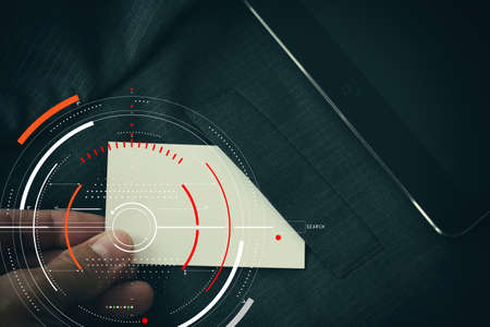 Concept of target focus digital diagram,graph interfaces,virtual UI screen,connections netwoork.Hipster finance analyst working at trendy officeの写真素材