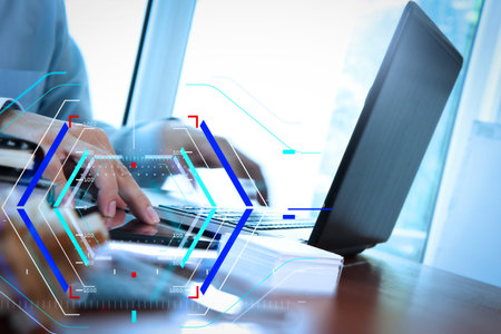 Concept of focus on target with digital diagram.Close up of business man hand working on  laptop...