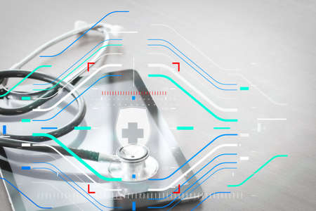 Health protection. Medical and health care concept.studio macro of a stethoscope and digital tablet on wood table background copy spaceの写真素材