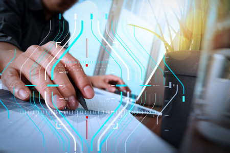 Business data analytics process management diagram.businessman hand working with new modern computer...