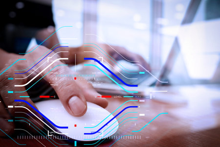 Concept of focus on target with digital diagram.close up of business man hand working on laptop...