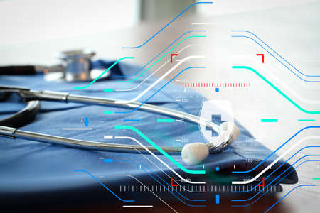 Health protection. Medical and health care concept.Stethoscope with blue doctor coat on wooden table with shallow DOF evenly matched の写真素材