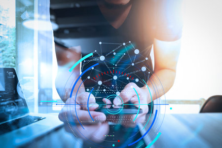 Data statistics charts and key performance indicators diagram.Website designer working digital tablet and smartphone and digital design diagram on wooden desk as conceptの写真素材