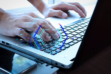 Concept of focus on target with digital diagram.Close up of business man hand working on  laptop...
