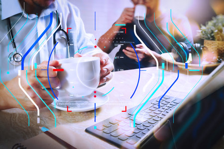 Health care and medical services with circular AR diagram record.Medical doctor team taking coffee break.using digital tablet docking smart keyboard and smart phone on marble desk.listen music,filter film effectの写真素材