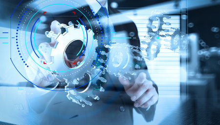 Concept of focus on target with digital diagram.double exposure of businessman hand show human gear...