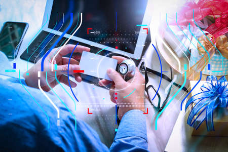Health care and medical services with circular AR diagram record.Gift giving,medical doctor Hand with credit card and hand with gift. の写真素材