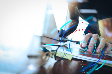 Data statistics charts and key performance indicators diagram.business documents on office table with smart phone and digital tablet and graph business with social network diagram and man working in the backgroundの写真素材