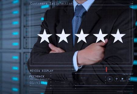 Five stars (5) rating with a businessman is touching virtual computer screen.For positive customer...