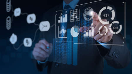 Data Management System (DMS) with Business Analytics concept. businessman working with provide information for Key Performance Indicators (KPI) and marketing analysis onn virtual computerの写真素材
