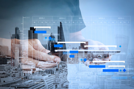 Project manager working and update tasks with milestones progress planning and Gantt chart...