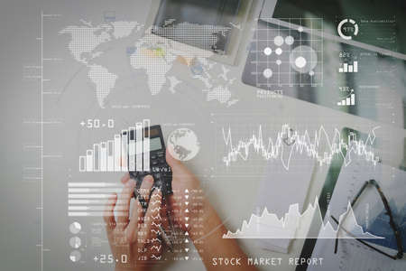 Investor analyzing stock market report and financial dashboard with business intelligence (BI), with key performance indicators (KPI).の写真素材