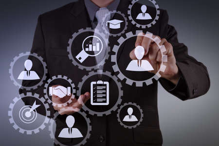 Human resources management with recruitment business working concept. HR manager is selecting candidate for hiring with virtual screen computer.の写真素材