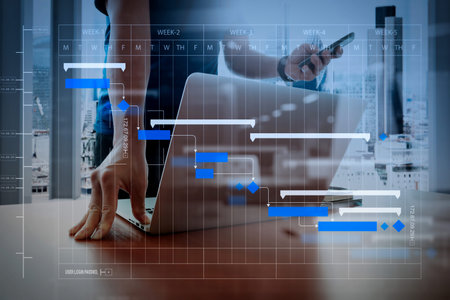 Project manager working and update tasks with milestones progress planning and Gantt chart...