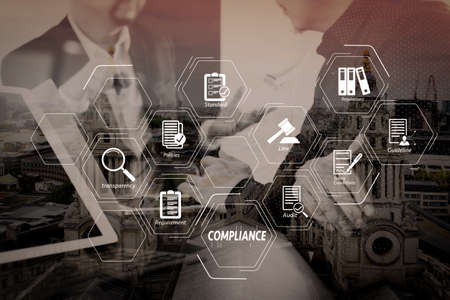 Compliance Virtual Diagram for regulations, law, standards, requirements and audit.Co working team meeting concept,Man using VOIP headset with digital tablet and latop computer and smart phone in modern office.の写真素材