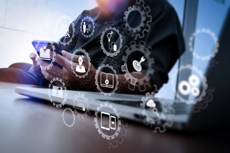 E-learning with connected gear cogs connected diagram virtual dashboard.designer hand working and...