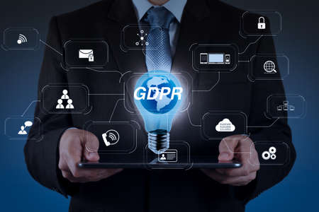 GDPR. Data Protection Regulation with Cyber security and privacy virtual diagram.businessman hand shows success and globe as conceptの写真素材