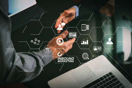Inbound marketing business with virtual diagram dashboard and Online or permission market concept.Business partnership meeting concept. Successful businessmen handshaking after perfect deal.の写真素材