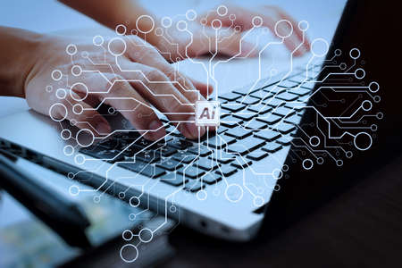 Artificial Intelligence (AI),machine learning with data mining technology on virtual dachboard.business man working on laptop computer on wooden desk as conceptの写真素材