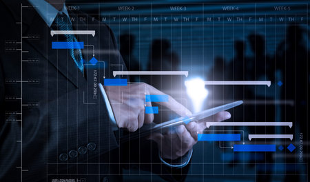 Project manager working and update tasks with milestones progress planning and Gantt chart...
