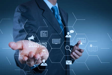 Outbound marketing business virtual dashboard with Offline or interruption marketing. business man with an open hand as showing something conceptの写真素材