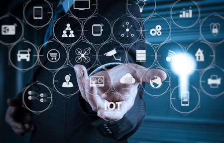 Internet of Things (IOT) technology with AR (Augmented Reality) on VR dashboard. business man with an open hand as showing something conceptの写真素材