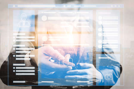 Web page browser of Social media Page VR Interface on the laptop computer.Double exposure of success businessman open his hand offer pen sign contract with London buildingの写真素材