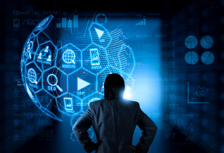 Digital marketing media (website ad, email, social network, SEO, video, mobile app) in virtual globe shape diagram.businessman working with new modern computer.の写真素材